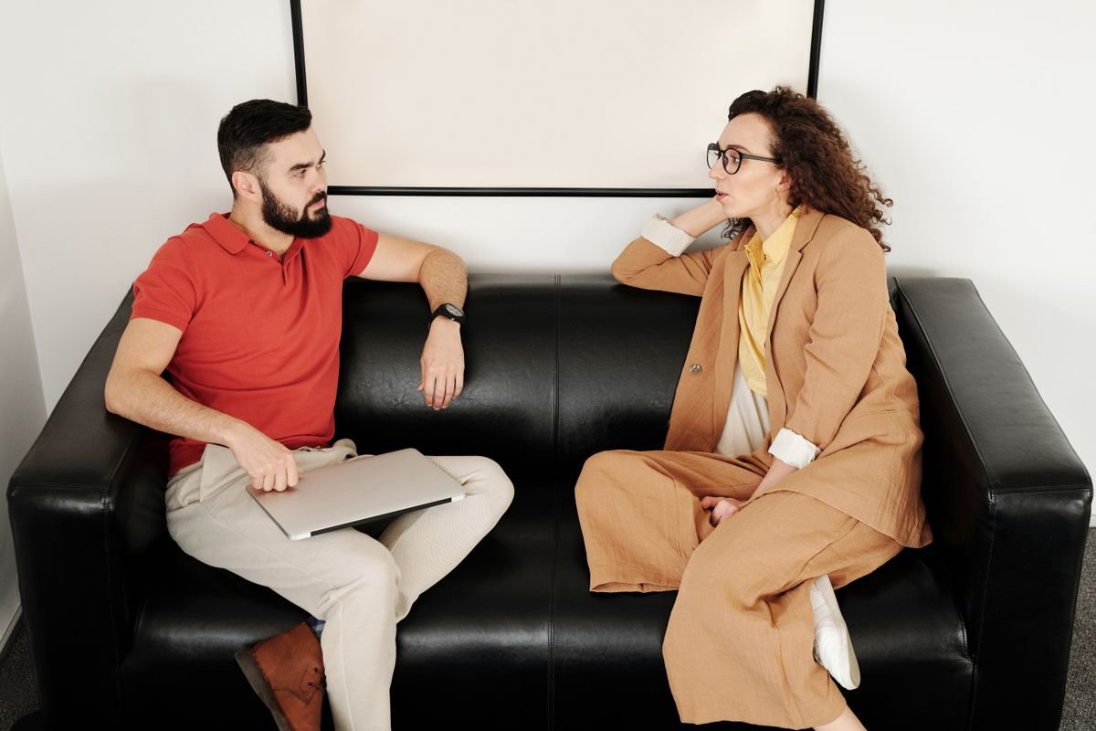Two colleagues talking in an office